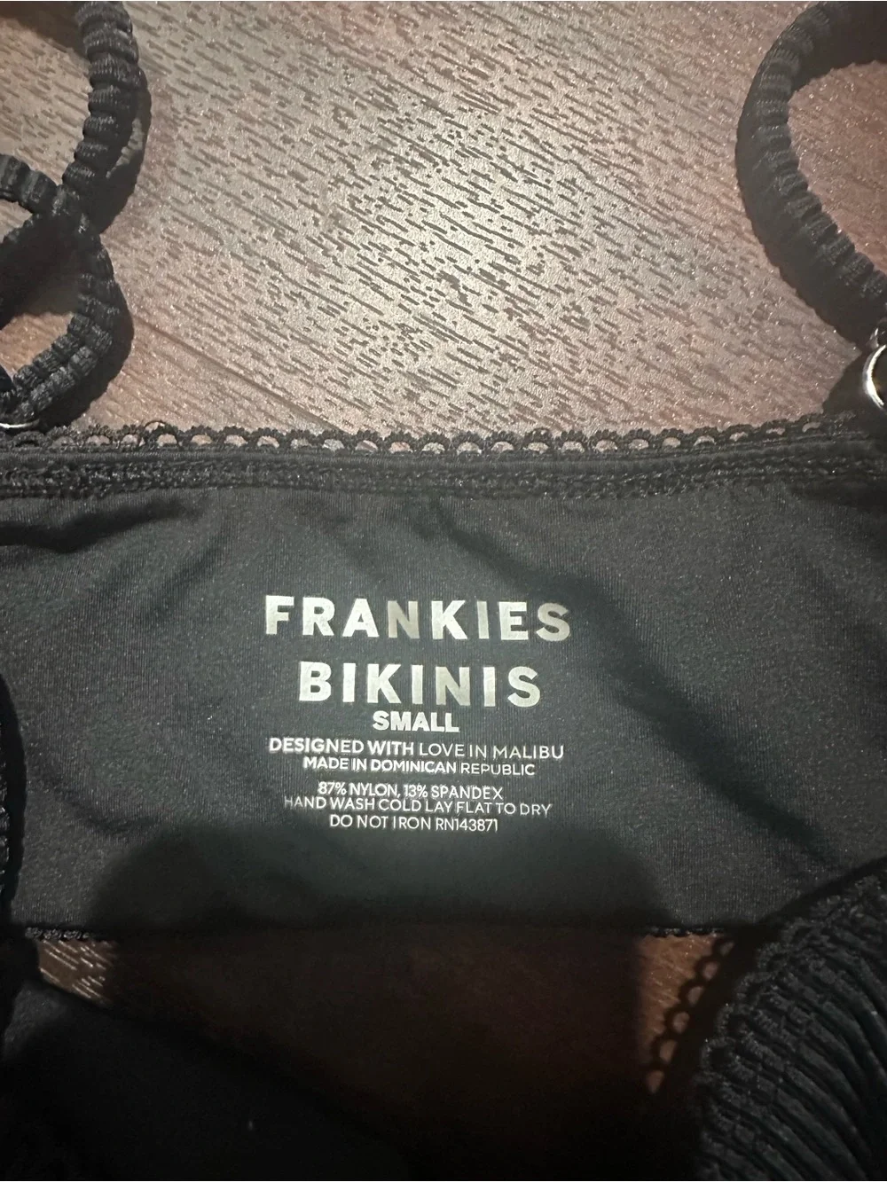 Frankie’s Bikinis black bathing suit top